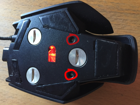 Two self-tapping Torx T6 case screws on the bottom of the Corsair M40 Raptor mouse